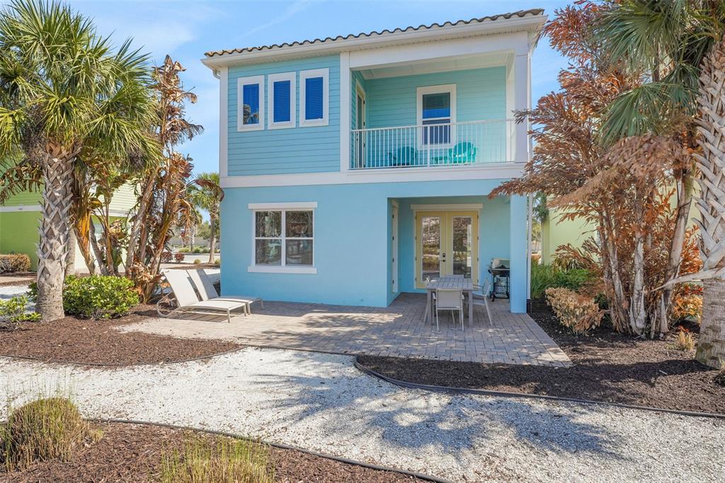 2968 Salted Rim Road Kissimmee, FL 34747 - Photo 31 of 86 a front view of a house with garden and chairs