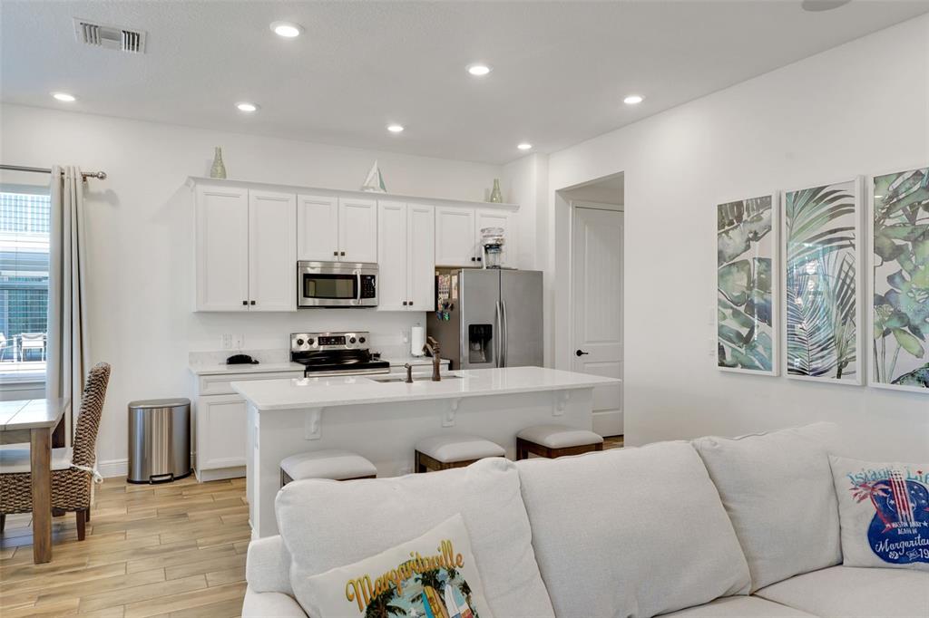 2968 Salted Rim Road Kissimmee, FL 34747 - Photo 6 of 86 a living room with furniture and a flat screen tv