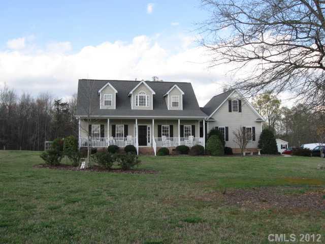 3601 Haigler Road Monroe, NC 28110 - Photo 1 of 14 a front view of a house with a garden