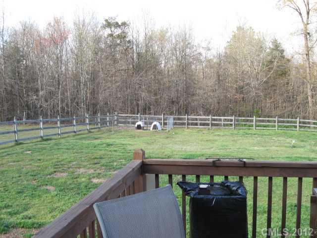 3601 Haigler Road Monroe, NC 28110 - Photo 5 of 14 a view of a green field with sitting area