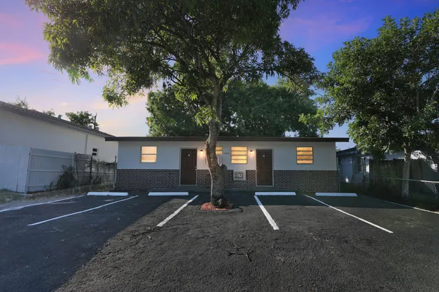 a front view of a house with yard