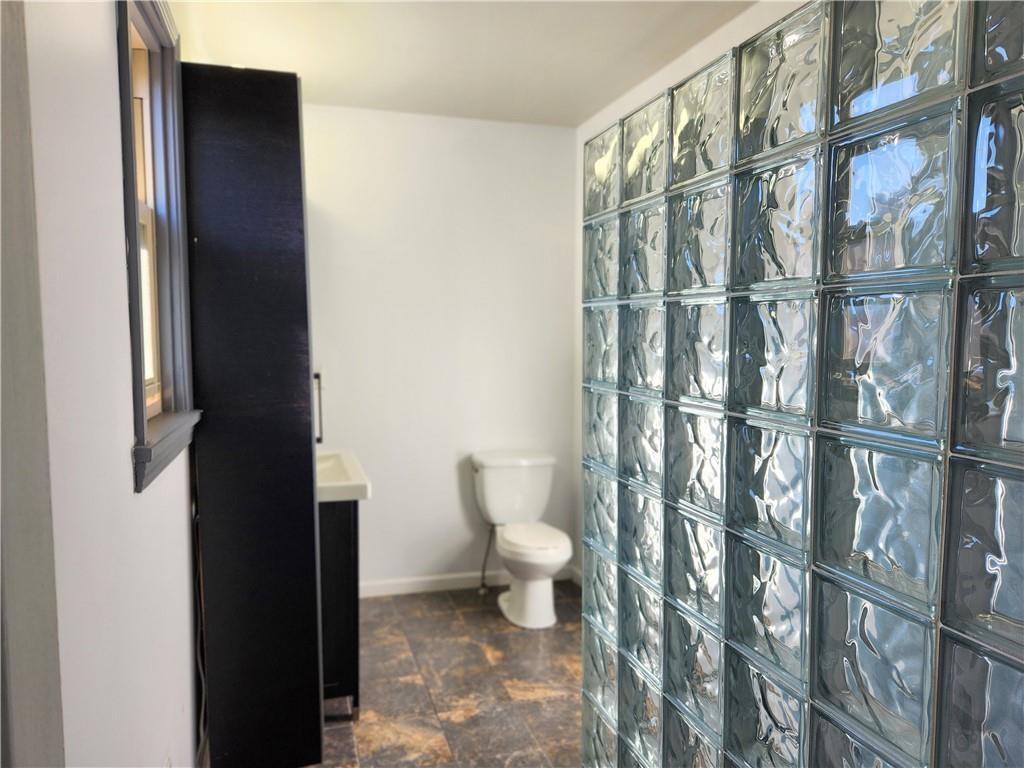 5330 Butler Street, Unit LOFT Pittsburgh, PA 15201 - Photo 6 of 6 a bathroom with a toilet and a shower