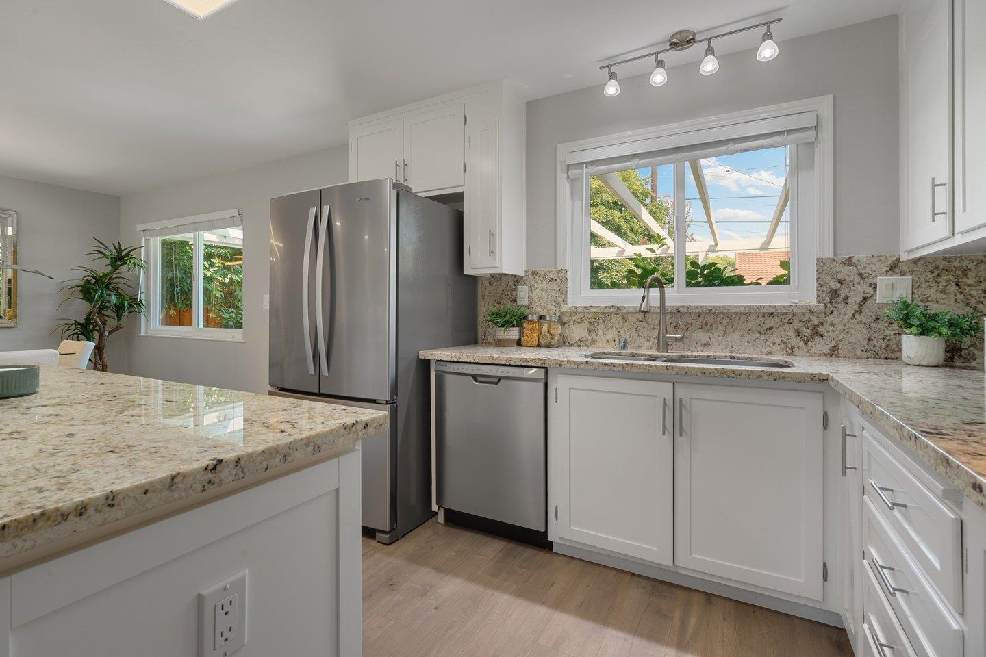 2425 Whitethorne Drive San Jose, CA 95128 - Photo 17 of 48 a kitchen with white cabinets and window