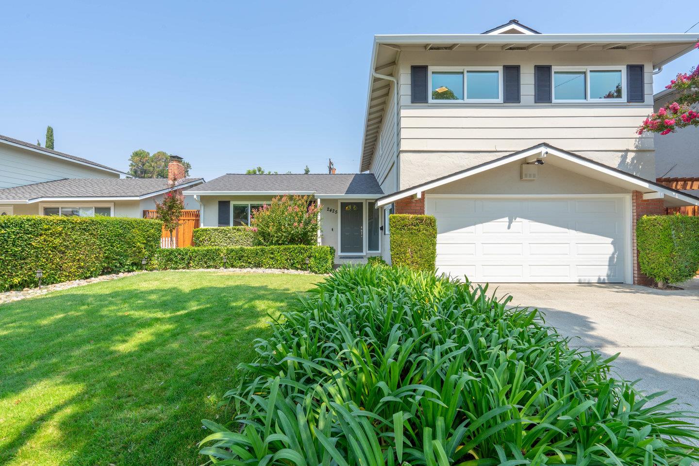 2425 Whitethorne Drive San Jose, CA 95128 - Photo 3 of 48 a front view of a house with a yard and garage