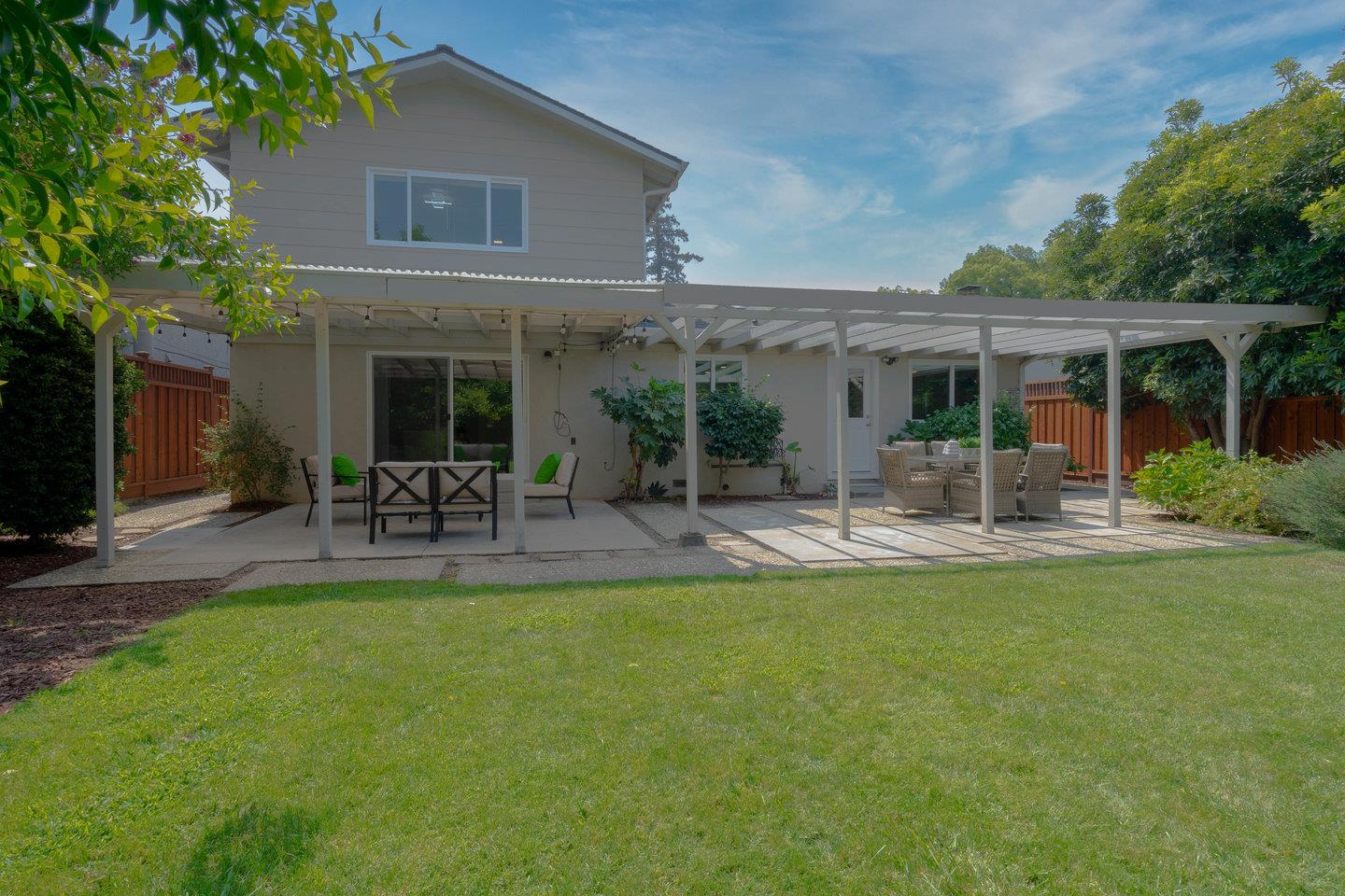 2425 Whitethorne Drive San Jose, CA 95128 - Photo 39 of 48 a view of a patio with table and chairs potted plants and large tree