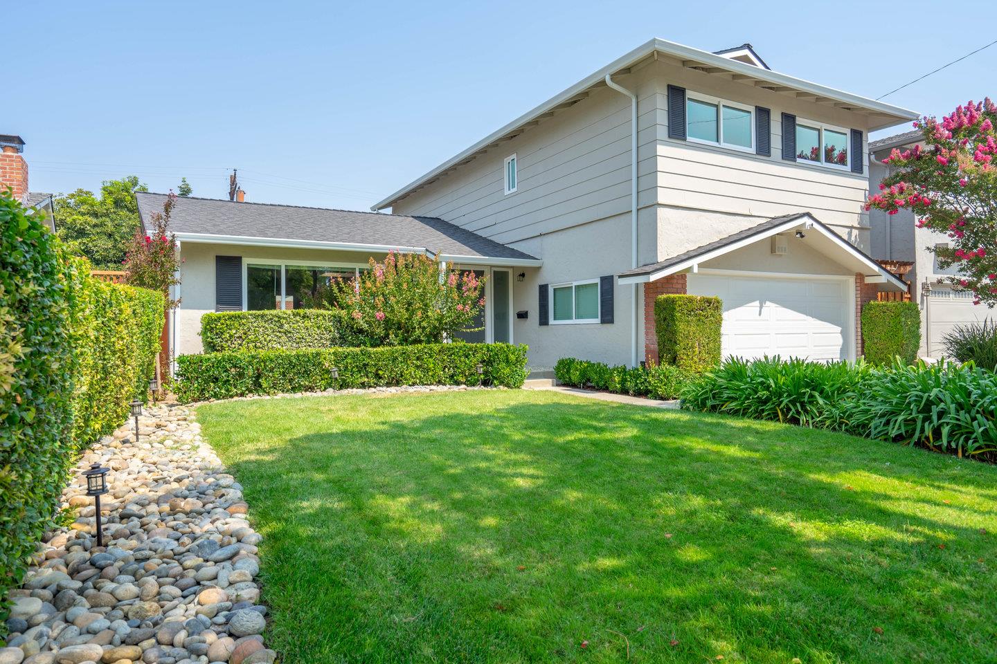 2425 Whitethorne Drive San Jose, CA 95128 - Photo 4 of 48 a front view of a house with garden