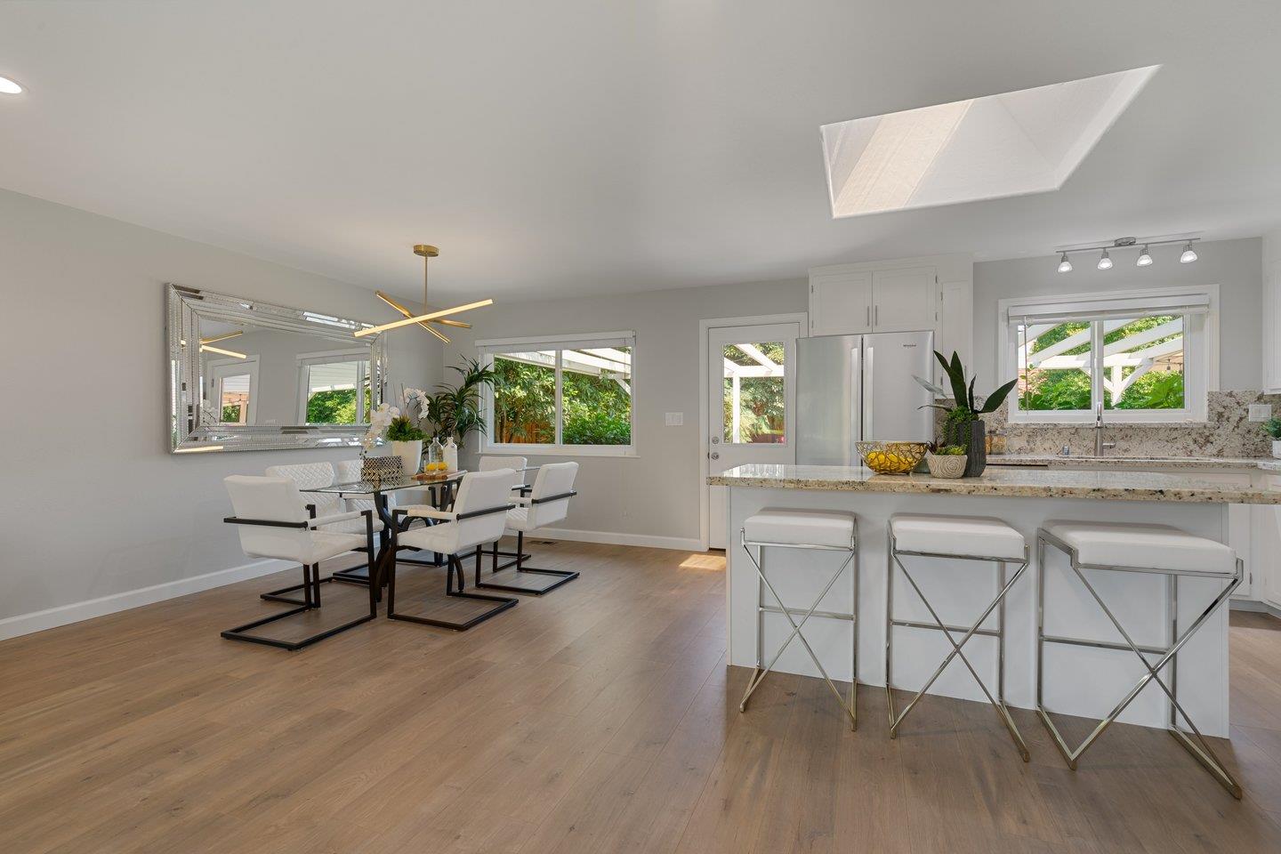 2425 Whitethorne Drive San Jose, CA 95128 - Photo 9 of 48 a view of a kitchen with a table and chairs