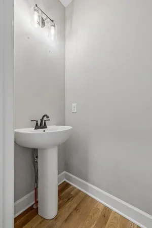 a bathroom with a sink and mirror