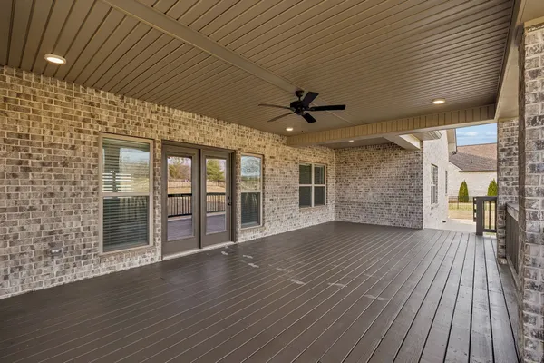 a view of a porch with wooden floor