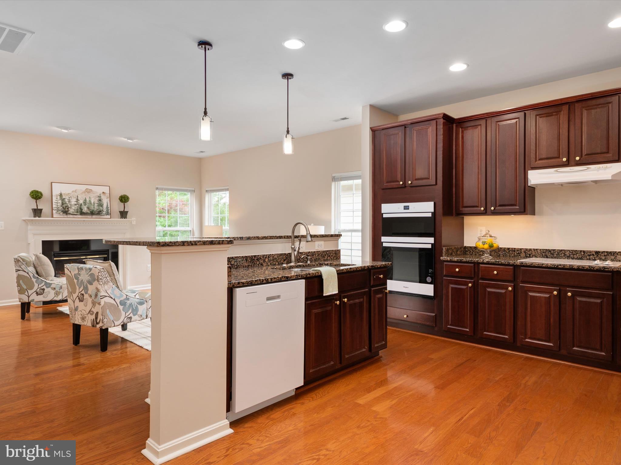 364 Overture Way Centreville, MD 21617 - Photo 15 of 62 a kitchen with stainless steel appliances granite countertop a stove refrigerator and cabinets