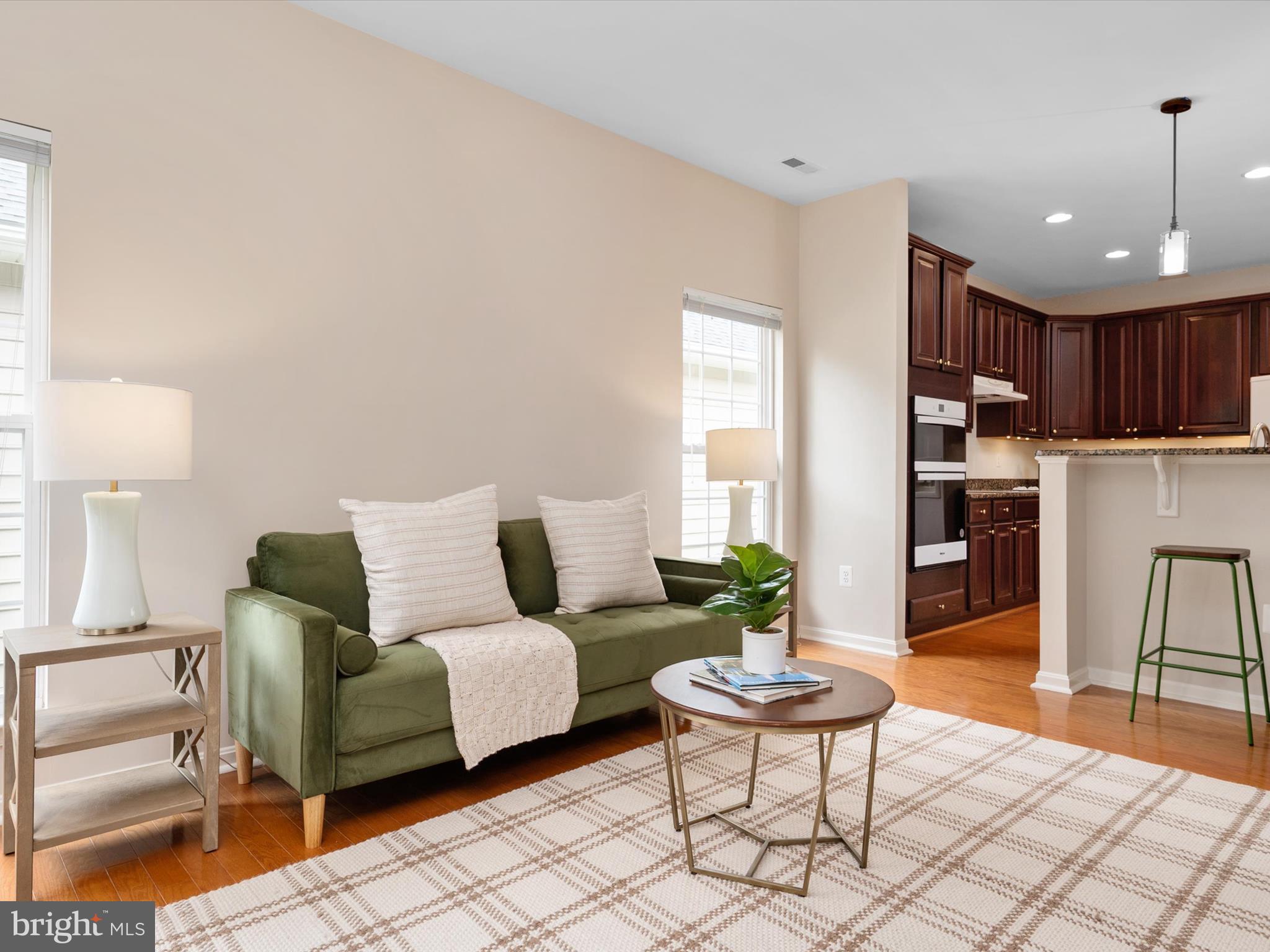 364 Overture Way Centreville, MD 21617 - Photo 20 of 62 a living room with furniture and a wooden floor