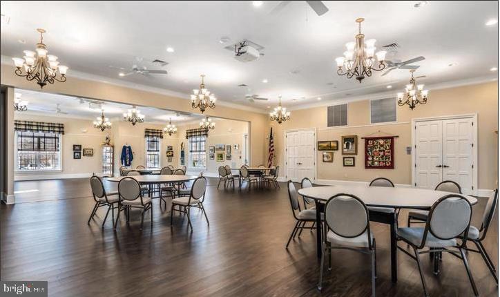 364 Overture Way Centreville, MD 21617 - Photo 43 of 62 a very nice looking dining room with furniture a chandelier and wooden floor