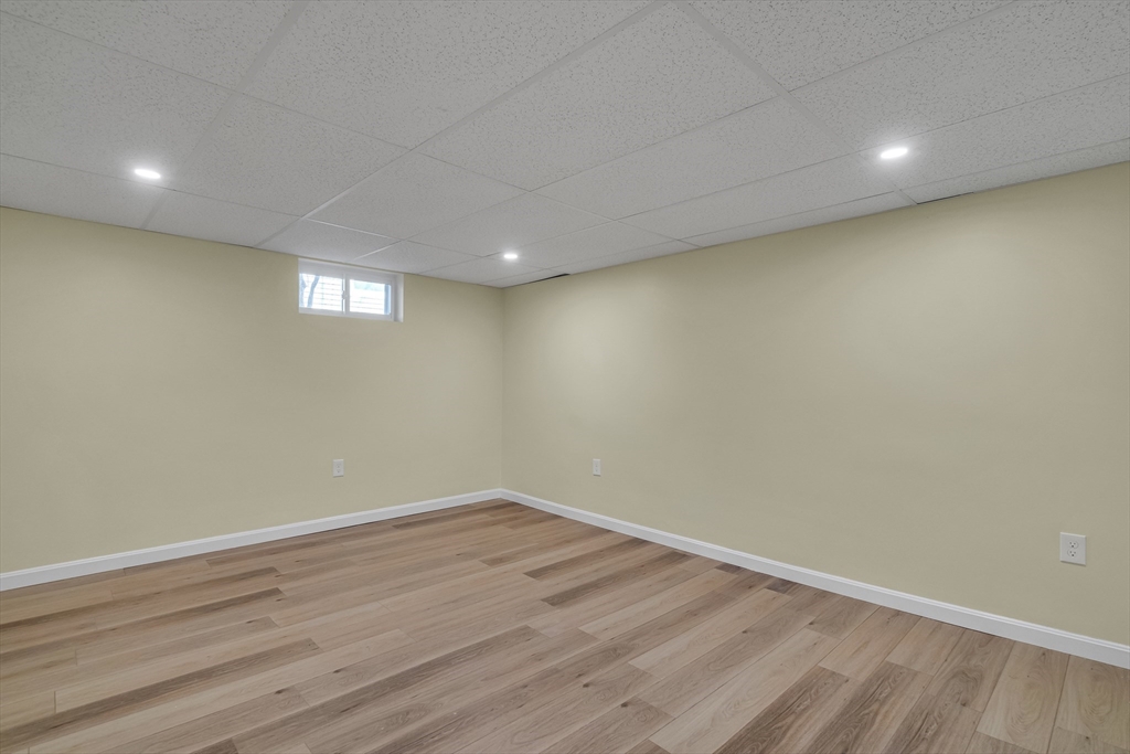 99 Truman Road Newton, MA 02459 - Photo 20 of 26 a view of room with wooden floor and window