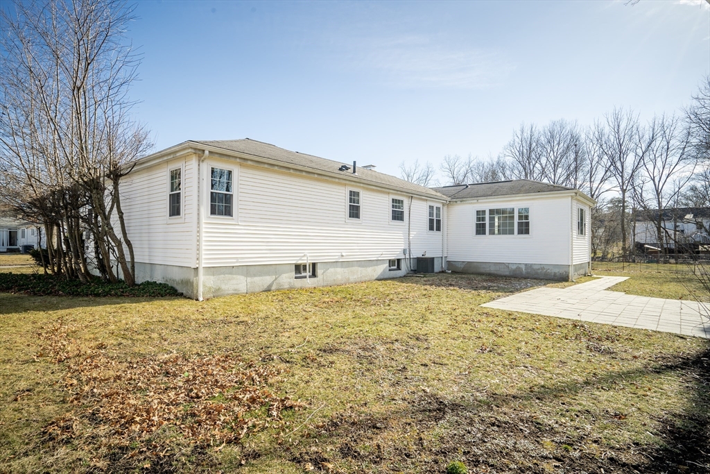 99 Truman Road Newton, MA 02459 - Photo 22 of 26 a house with a yard