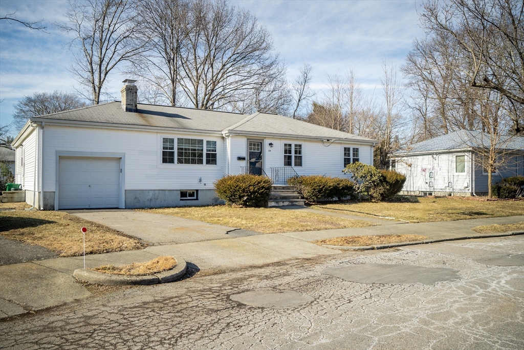 99 Truman Road Newton, MA 02459 - Photo 23 of 26 a front view of a house with a yard