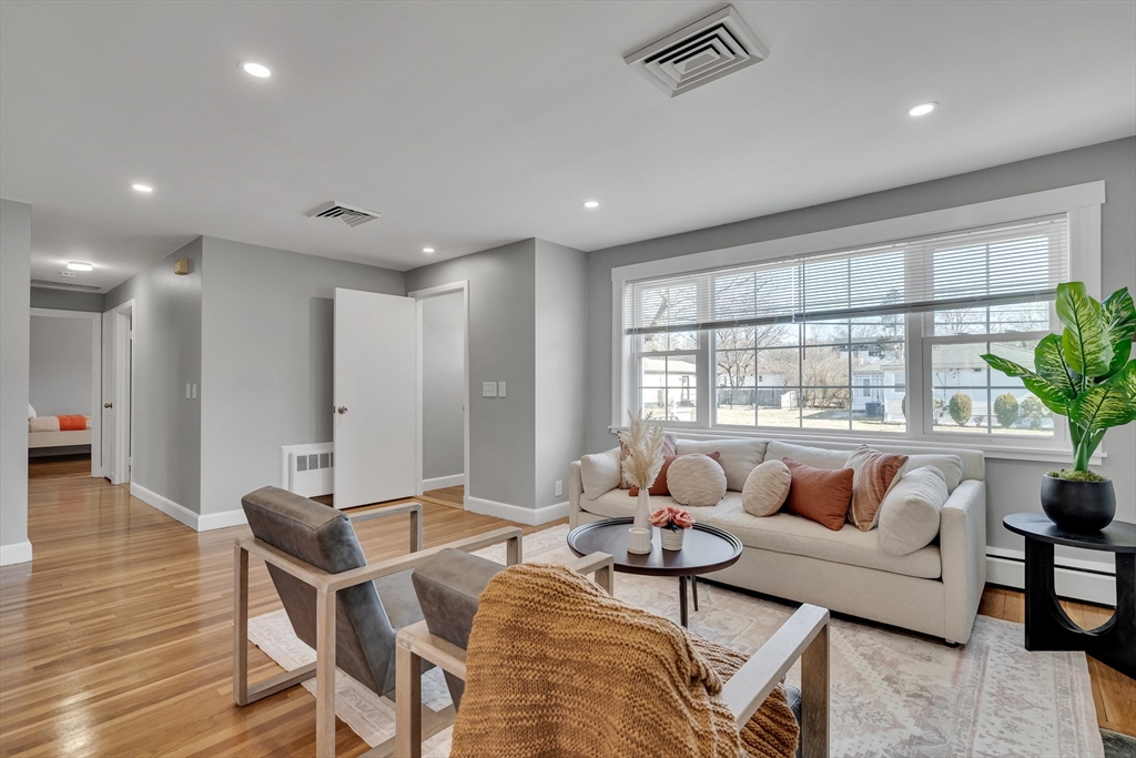 99 Truman Road Newton, MA 02459 - Photo 3 of 26 a living room with furniture and a large window