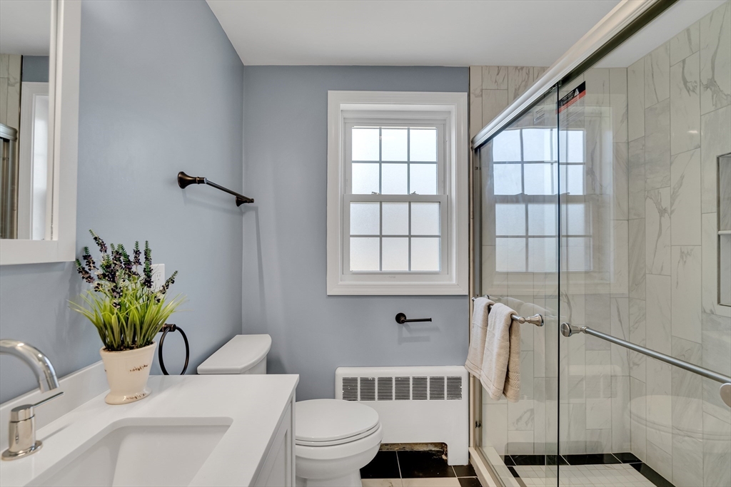 99 Truman Road Newton, MA 02459 - Photo 7 of 26 a bathroom with a sink toilet and shower