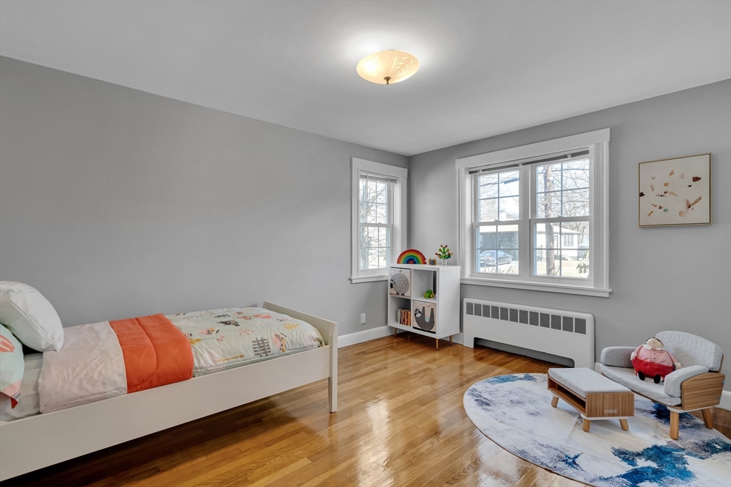 99 Truman Road Newton, MA 02459 - Photo 8 of 26 a bedroom with furniture and a window