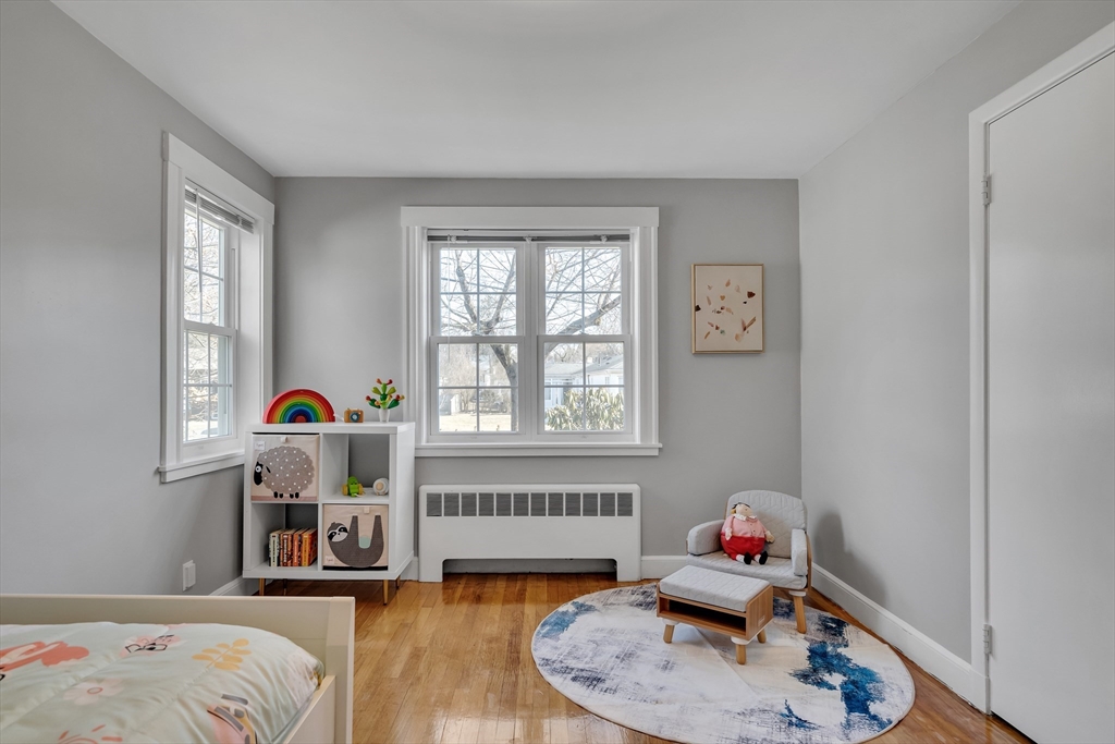 99 Truman Road Newton, MA 02459 - Photo 9 of 26 a bedroom with a bed and a window