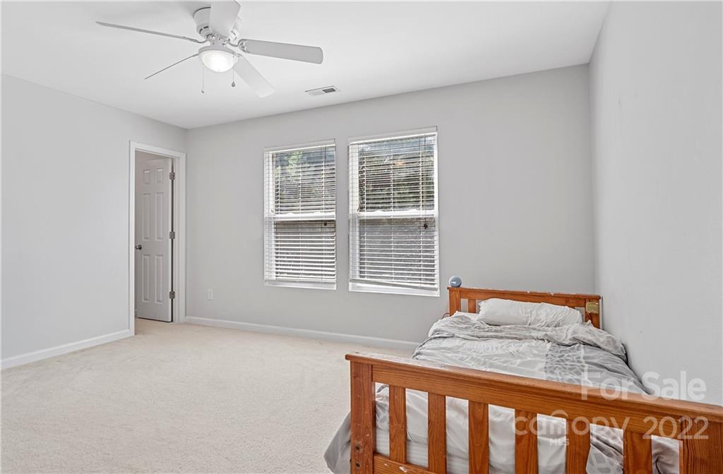 2532 Spring Breeze Way Monroe, NC 28110 - Photo 14 of 21 a bedroom with a bed and window
