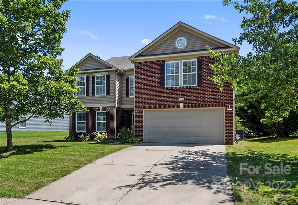 2532 Spring Breeze Way Monroe, NC 28110 - Photo 2 of 21 a front view of a house with a yard