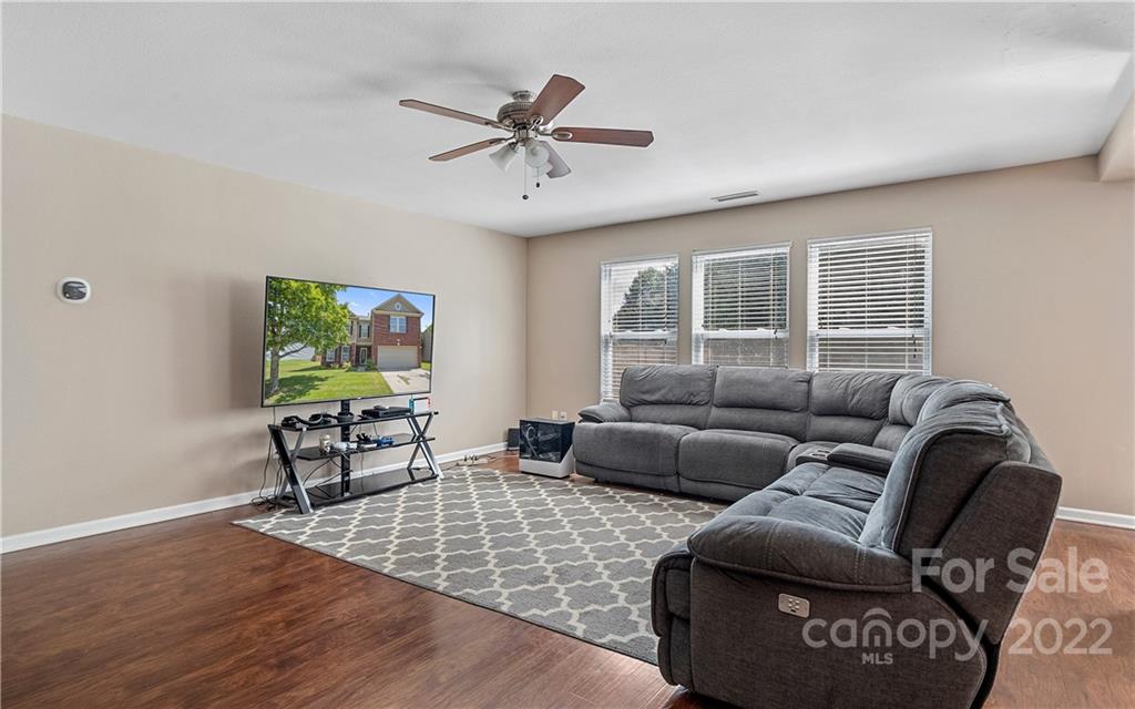 2532 Spring Breeze Way Monroe, NC 28110 - Photo 9 of 21 a living room with furniture and a flat screen tv