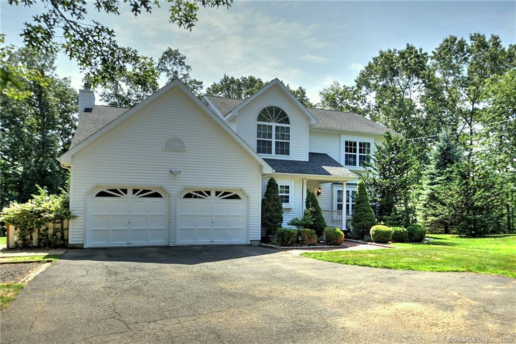 645 Booth Hill Road Trumbull, CT 06611 - Photo 1 of 1 a front view of a house with a yard and garage