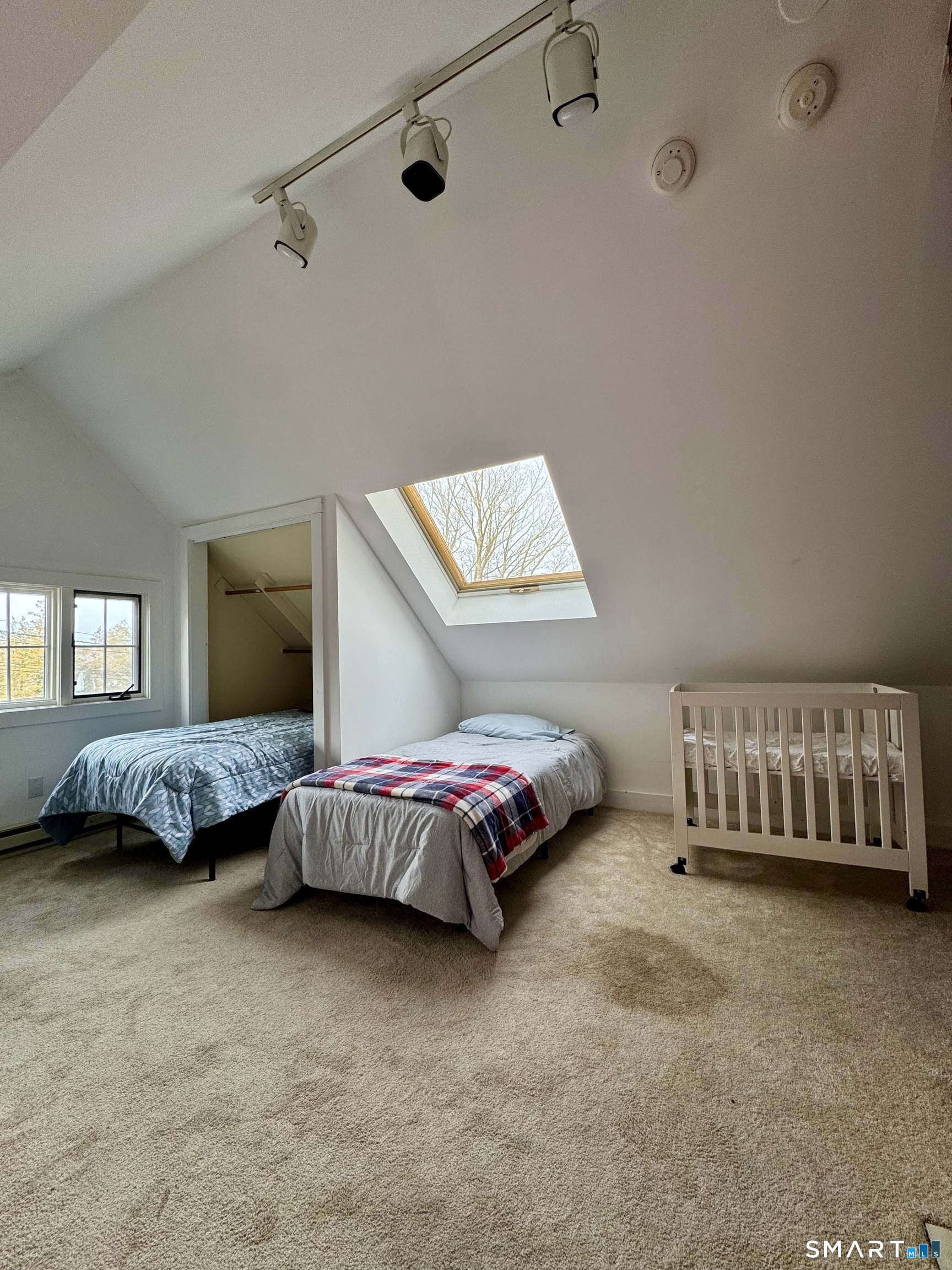38 Wooster Hts Road Danbury, CT 06810 - Photo 12 of 15 a spacious bedroom with a bed and a couch