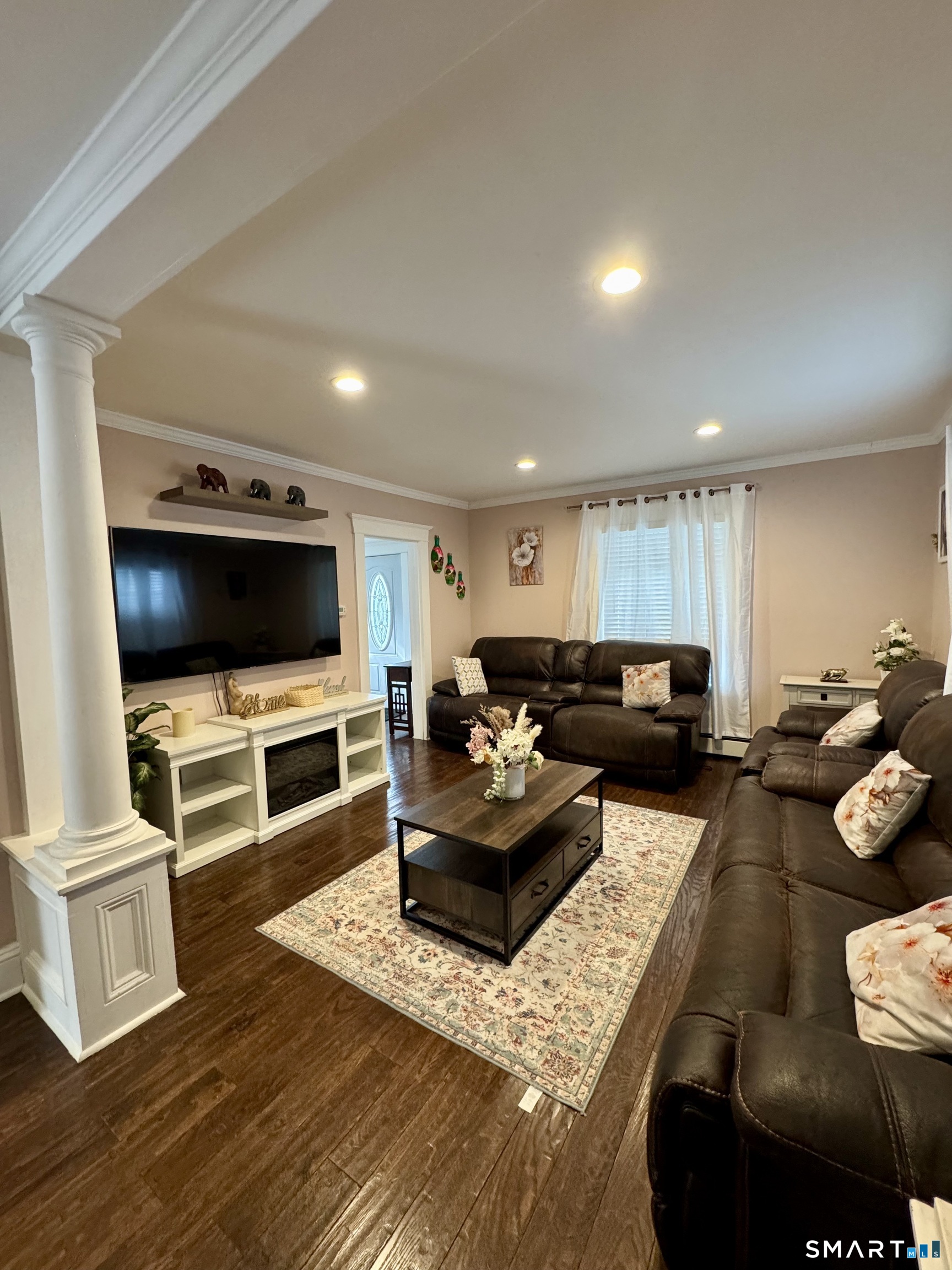 38 Wooster Hts Road Danbury, CT 06810 - Photo 3 of 15 a living room with furniture and a flat screen tv