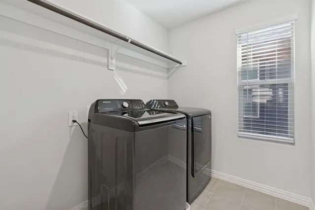 a utility room with closet dryer and washer