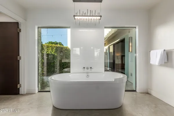 a bedroom with a bed and a sink