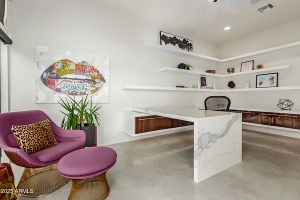a large kitchen with a large counter top space a sink and stainless steel appliances