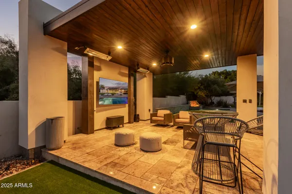a view of a swimming pool with a patio