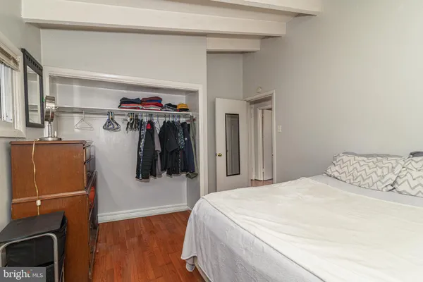 a bedroom with a bed and a walk in closet