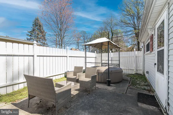a view of a patio with couches and potted plants