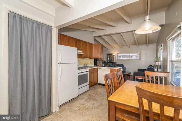 a kitchen with cabinets a counter space and stainless steel appliances