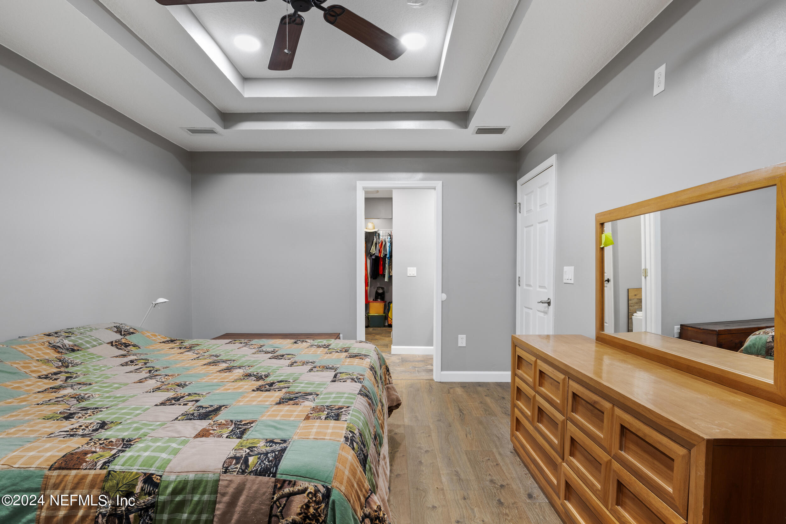 7191 Raleigh Road Keystone Heights, FL 32656 - Photo 10 of 31 a bedroom with a bed and a dresser