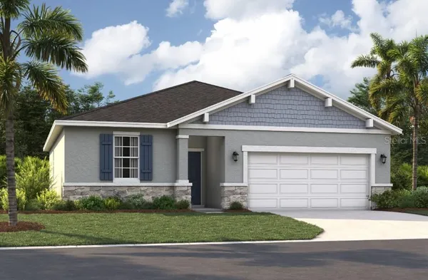 a front view of a house with a garden and entryway
