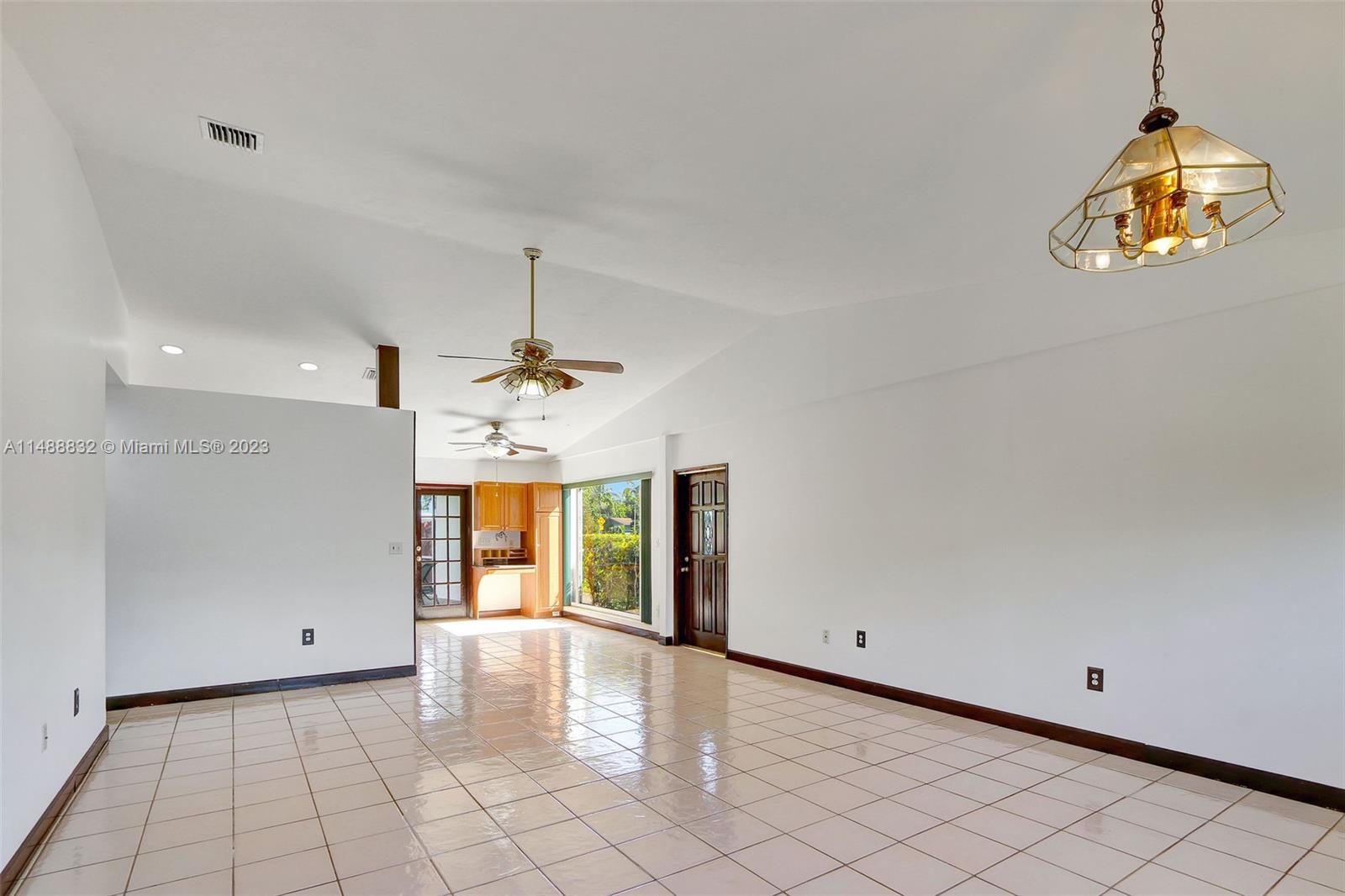 10455 Southwest 112th Street Miami, FL 33176 - Photo 12 of 21 a view of a room with window and chandelier