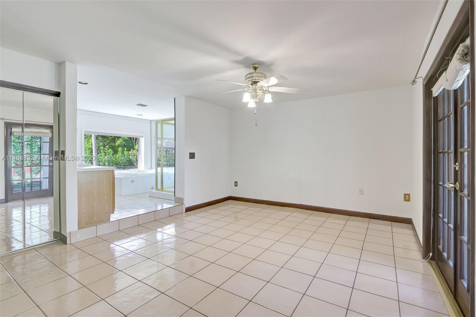 10455 Southwest 112th Street Miami, FL 33176 - Photo 14 of 21 an empty room with windows and entrance