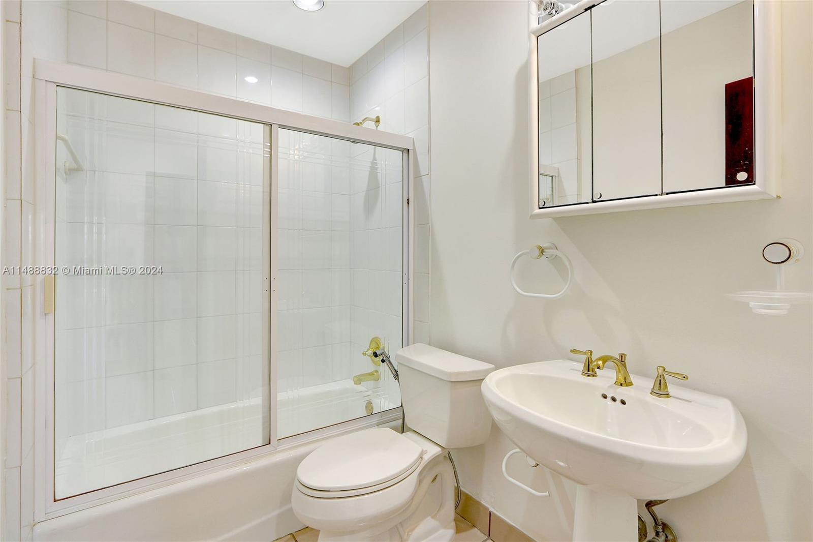 10455 Southwest 112th Street Miami, FL 33176 - Photo 19 of 21 a bathroom with a sink toilet and shower