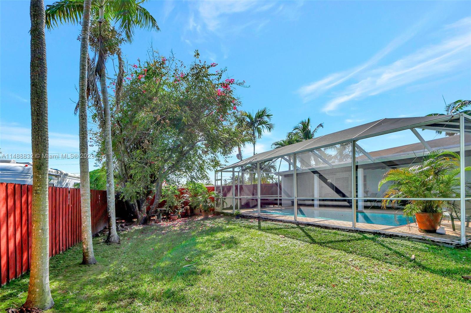 10455 Southwest 112th Street Miami, FL 33176 - Photo 8 of 21 a view of a house with backyard and a tree