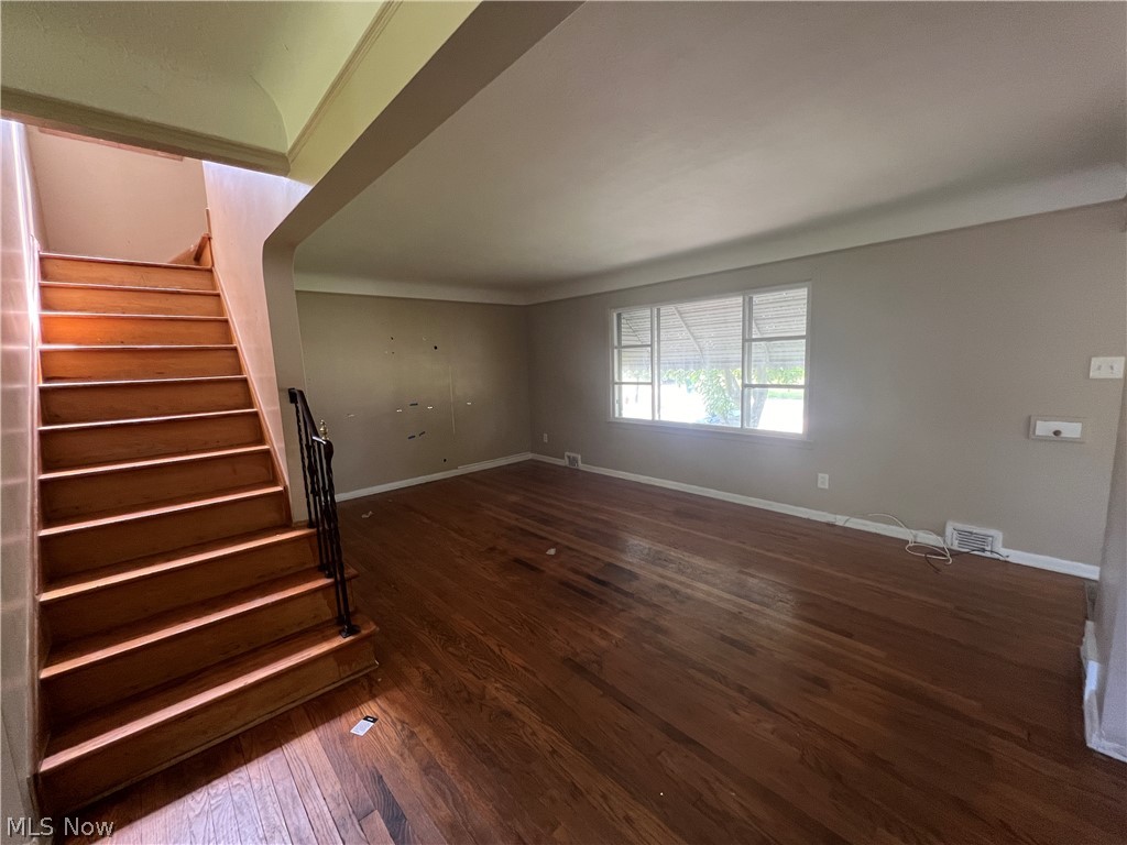 20731 Donnybrook Road Maple Heights, OH 44137 - Photo 4 of 17 Staircase with dark hardwood / wood-style floors