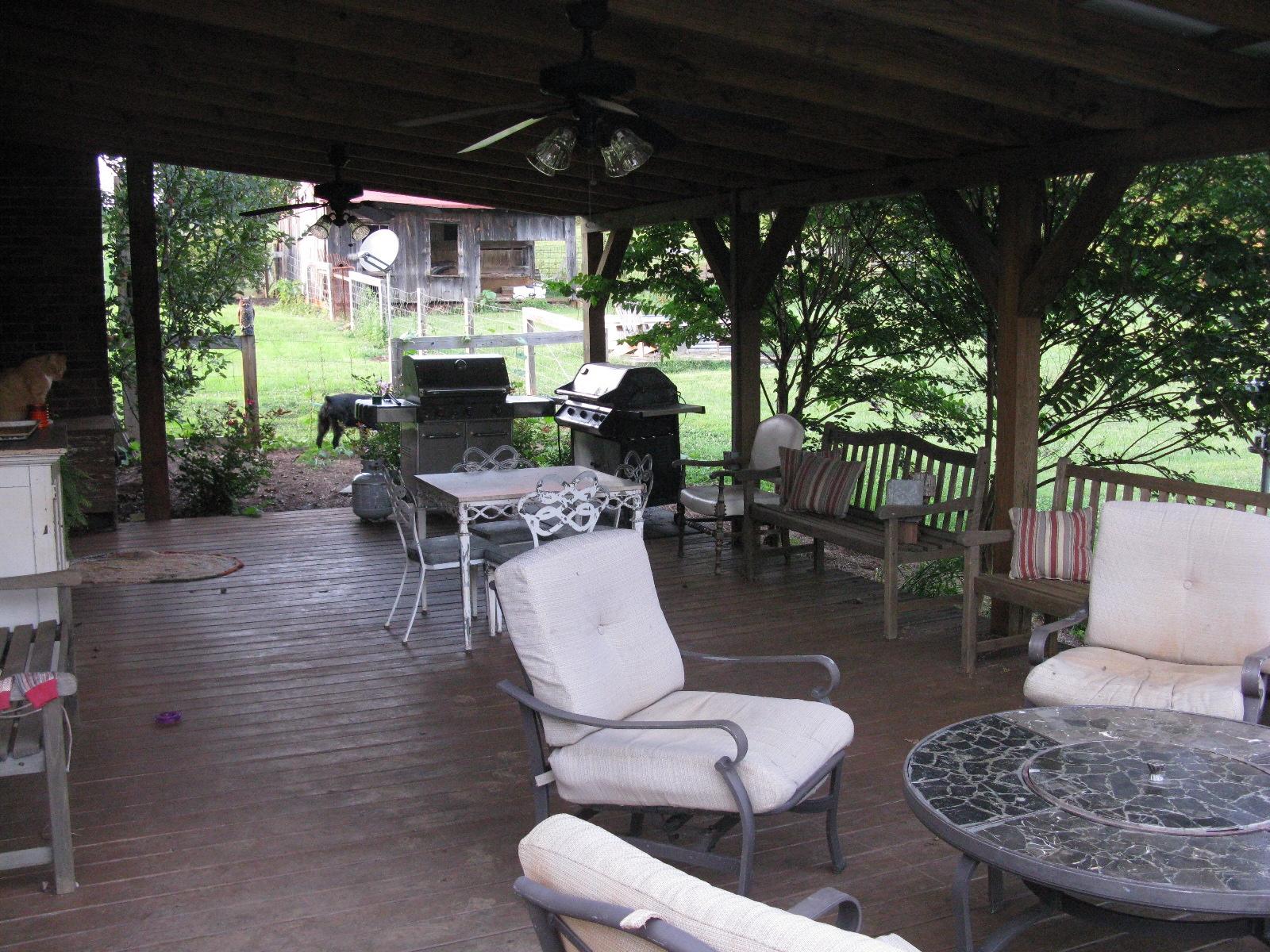 3970 Foothills Road Callaway, VA 24067 - Photo 21 of 41 a outdoor space with furniture a large window and a fireplace