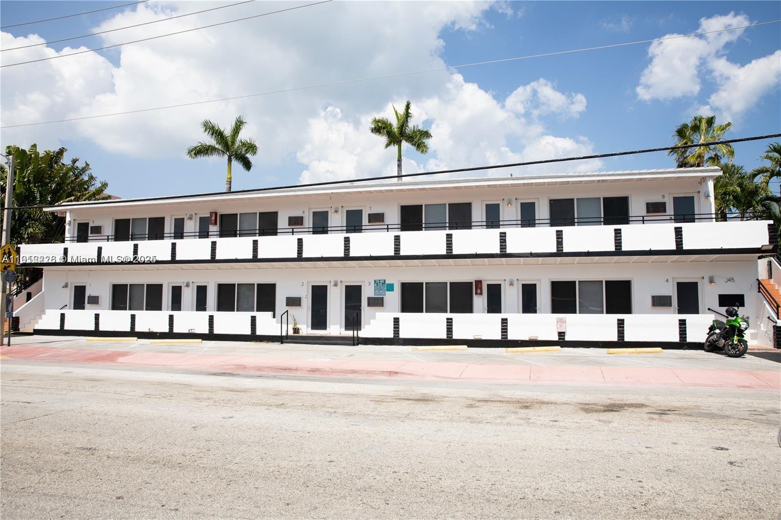 345 85th Street, Unit 2 Miami Beach, FL 33141 - Photo 1 of 13 a front view of building with street view