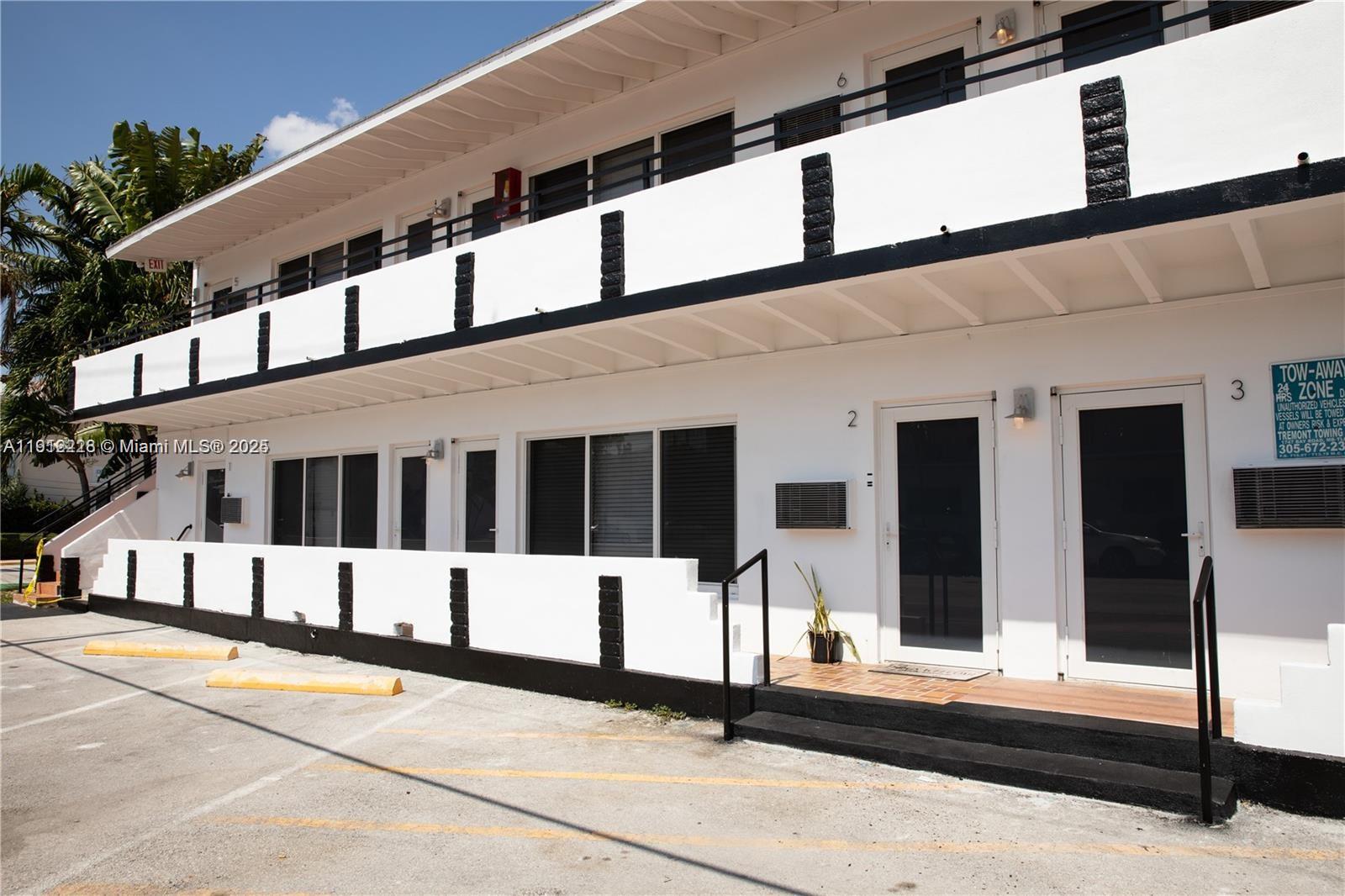 345 85th Street, Unit 2 Miami Beach, FL 33141 - Photo 2 of 13 a view of building with street