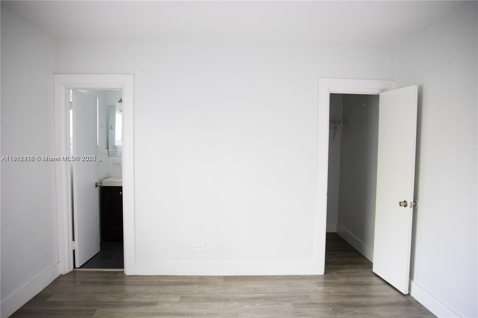 345 85th Street, Unit 2 Miami Beach, FL 33141 - Photo 10 of 13 a view of a hallway with wooden floor