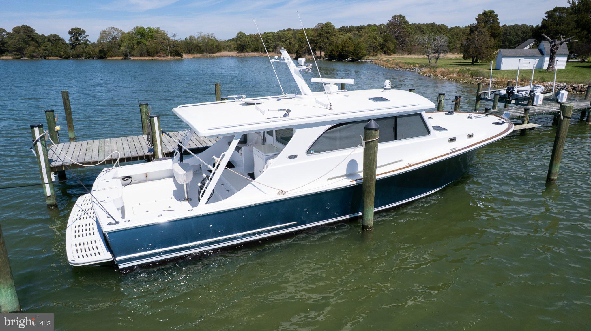 5704 Ross Neck Road Cambridge, MD 21613 - Photo 16 of 98 Elegant boat gliding on tranquil waters.