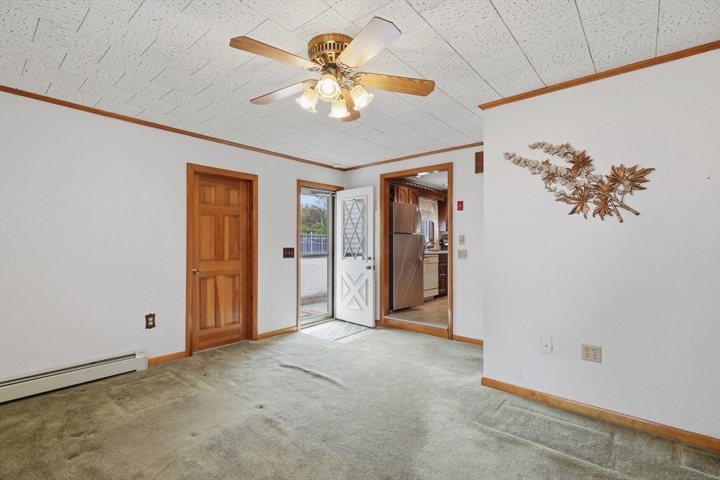 10 Deluca Road Milford, MA 01757 - Photo 15 of 37 an empty room with fan and windows
