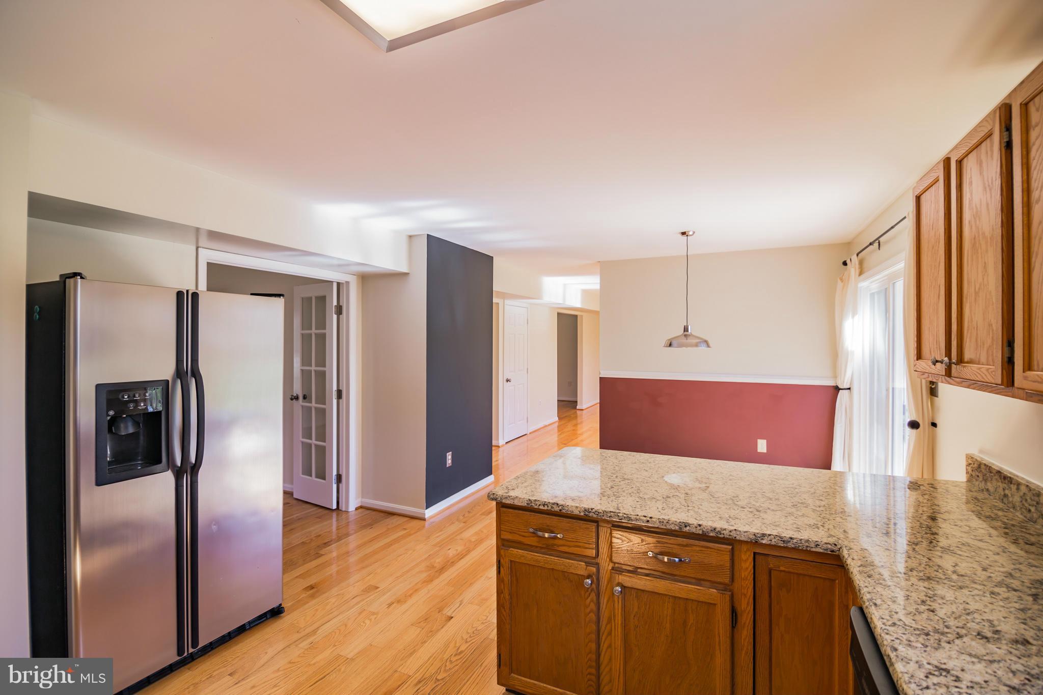 3160 Jones Road Dunkirk, MD 20754 - Photo 8 of 27 a kitchen with stainless steel appliances granite countertop a refrigerator and a sink